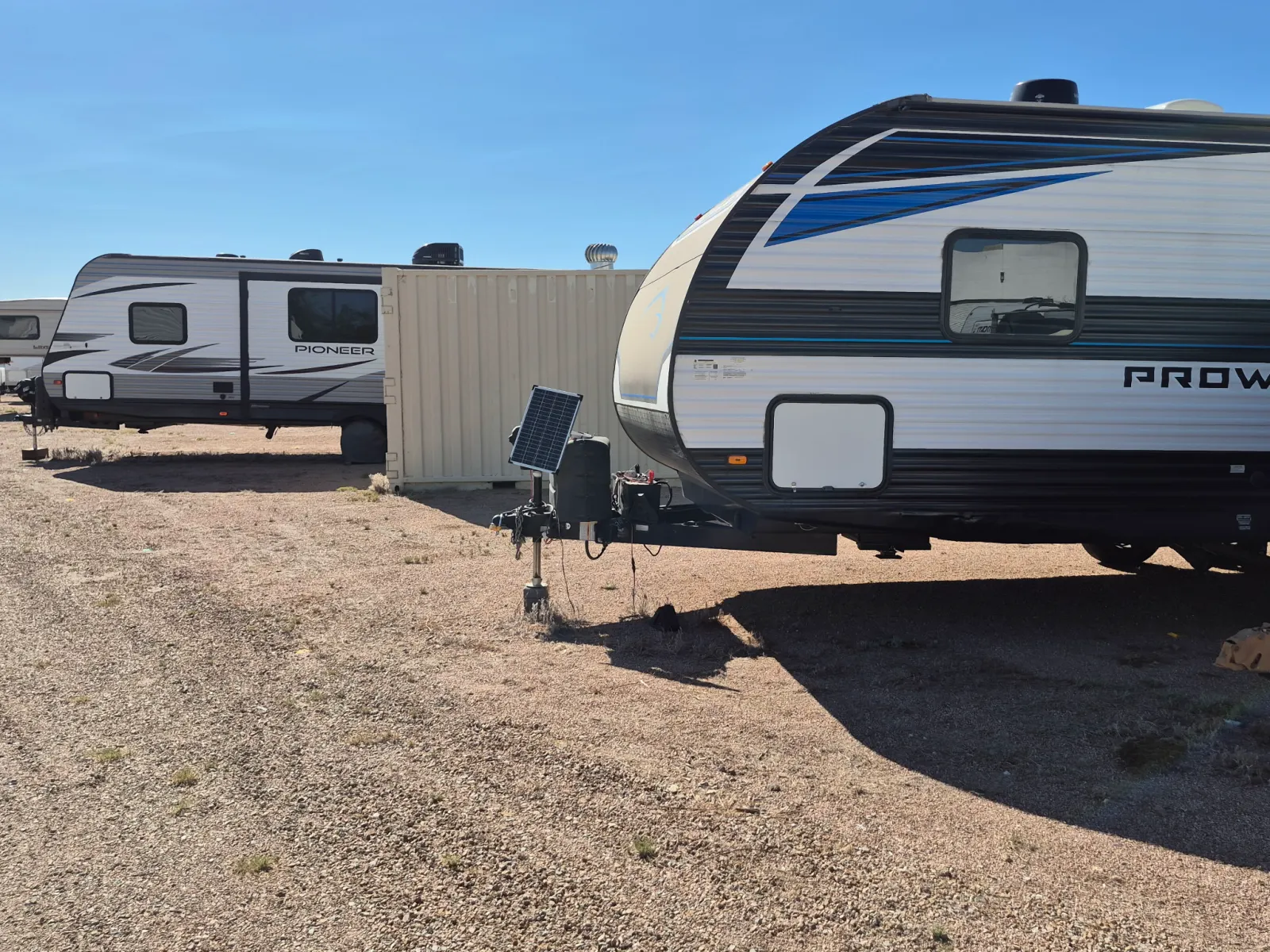 Travel trailers parked in the property storage rows